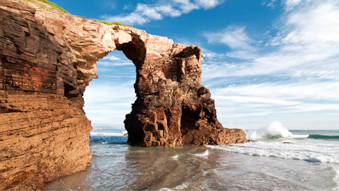 This New Year, Discover The Surreal Arches At Playa de Las Catedrales In Spain