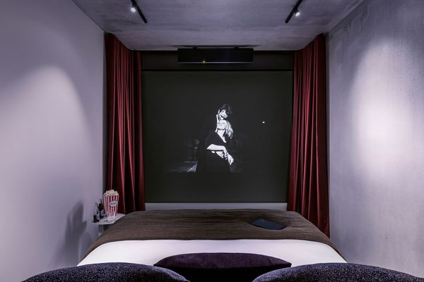 The First Cinema Hotel Opens In Paris — And Guests Get Their Own Screen Projectors In Rooms