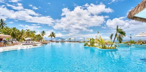 This Brand-New Tahiti Resort Has The Island's Largest Pool — With A Swim-Up Bar, Cabanas, And Incredible Sunset Views
