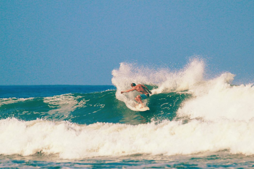 Surfing in Nosara, Costa Rica, one of the best surf towns in the world