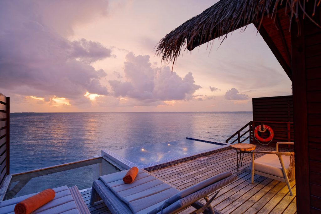 Deck with sunset light at Reef Pool Water Villa, Grand Park Kodhipparu, Maldives