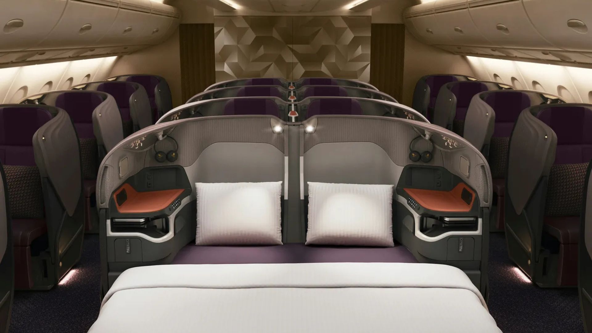 An airplane window showing clouds below.