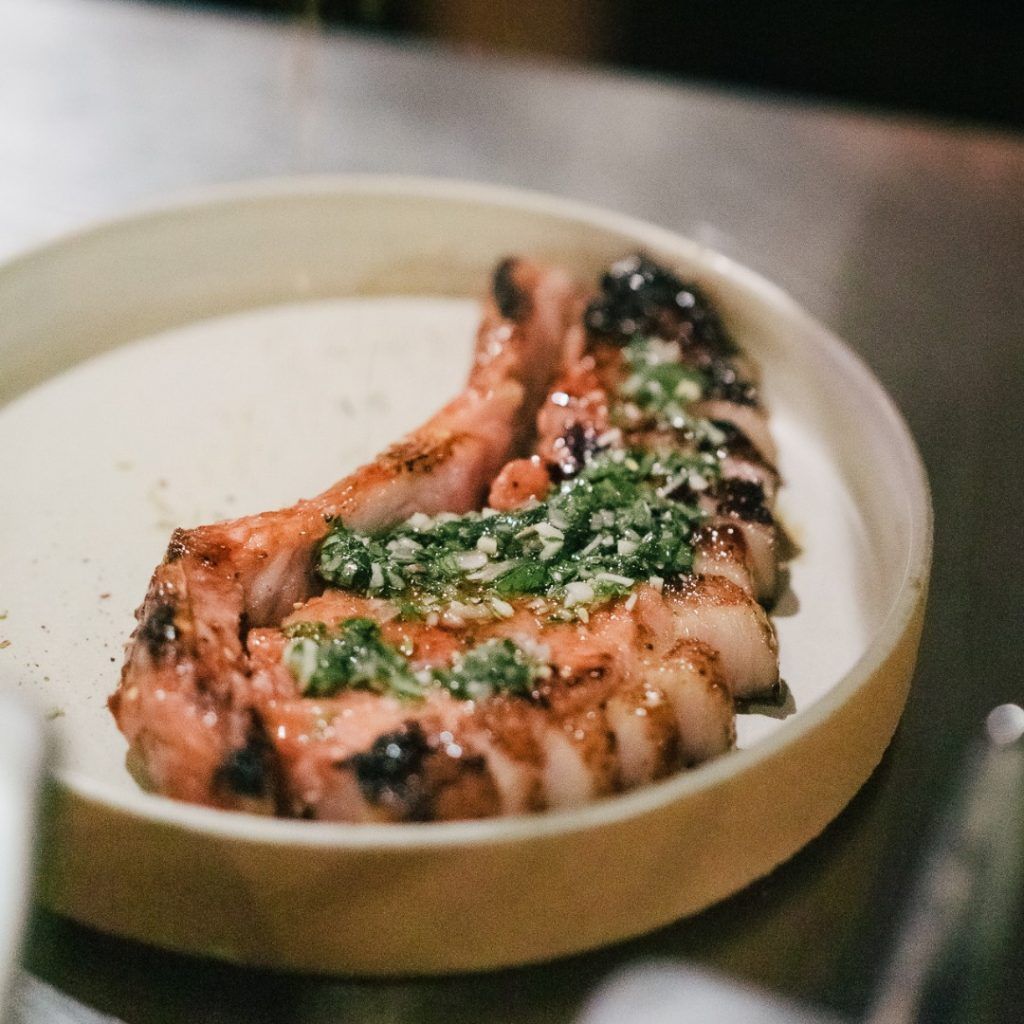 The signature dish, Za’atar Char Grilled Pork Loin at Honey & Smoke