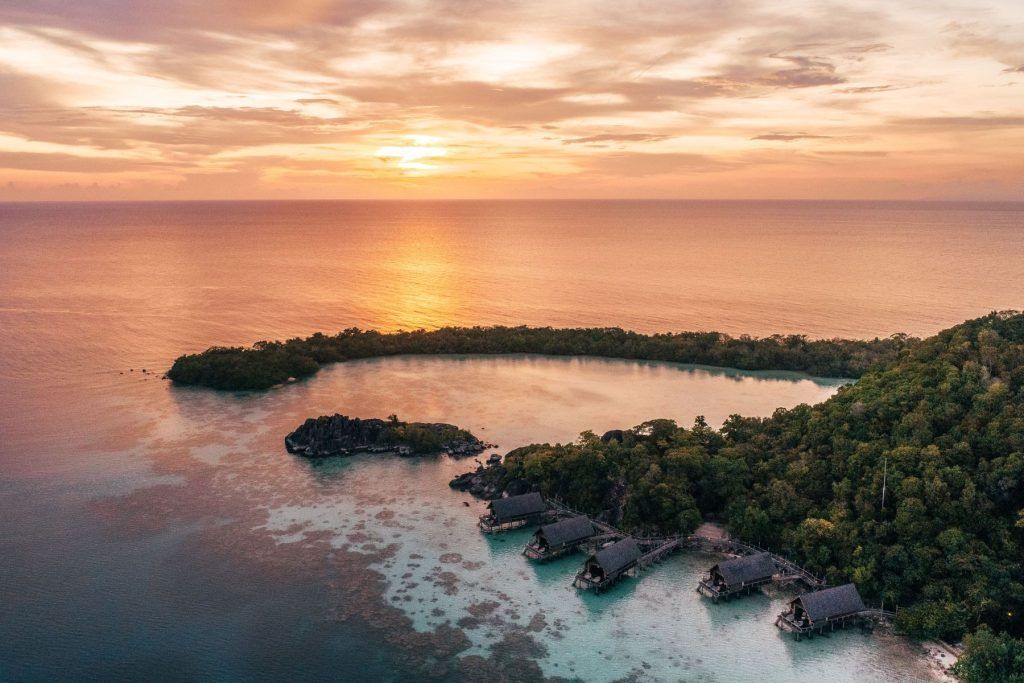 Overwater Suite sunset with setigi reef background