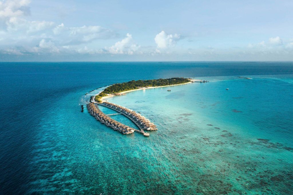 The stunning nine-kilometer coral reef of Fairmont Sirru Fen Fushi, one of the most eco- friendly resorts in the Maldives
