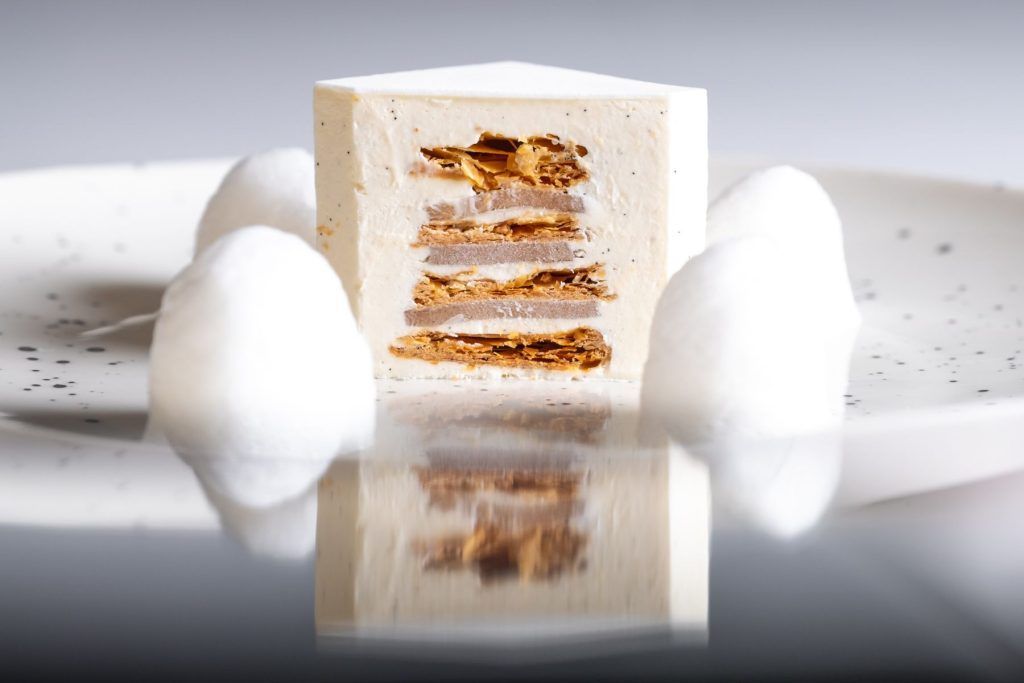 White Millefeuille Tahtitian vanilla cream Jasmine jelly and Voatsiperifery cloud - carte ouverture. Courtesy of Cristal Room by Anne-Sophie Pic