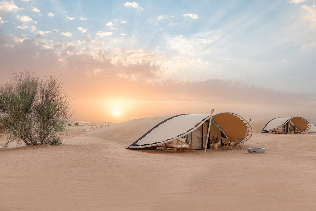 The Nests' domed roofs blend into the dunes