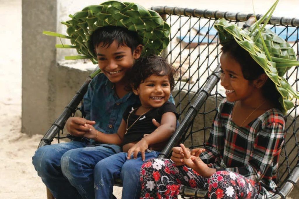Kids on Maduvvaree Island, Maldives, which you can visit from nearby Alila Kothaifaru