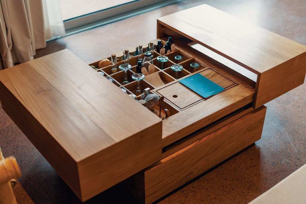 In-room maxi-bar hidden in a table at Desa Potato Head