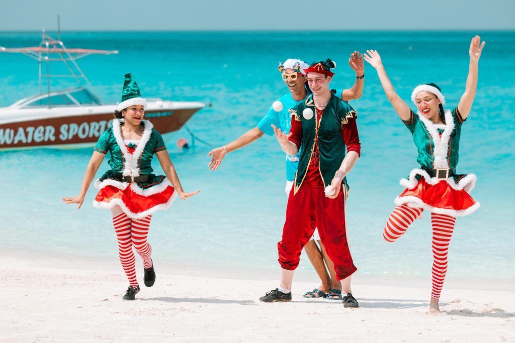 Elves on the beach during Santa's arrival at Hilton Maldives Amingiri
