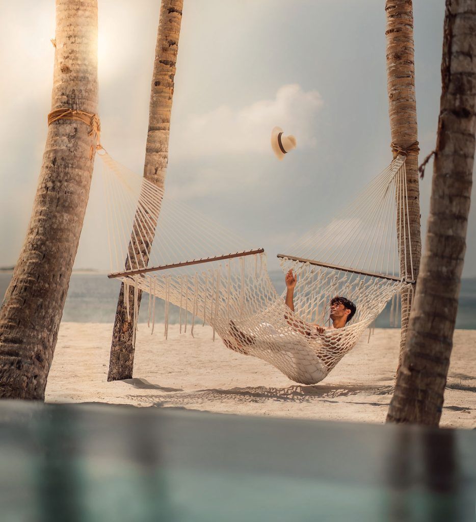 Ali on beach hammock at JOALI Being Maldives
